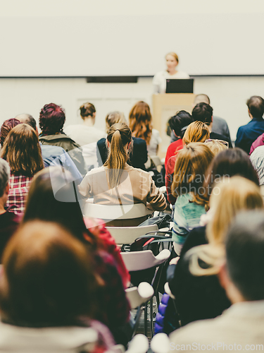 Image of Woman giving presentation on business conference.