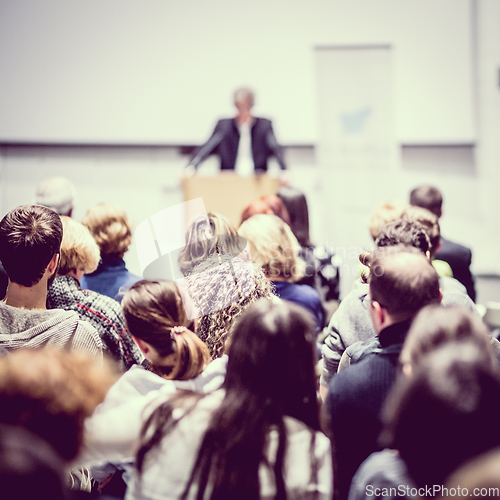 Image of Business speaker giving a talk at business conference event.