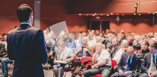 Image of Speaker at Business Conference and Presentation.