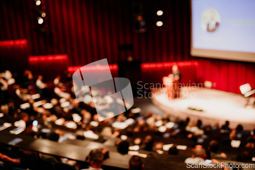 Image of Woman giving presentation on business conference event.