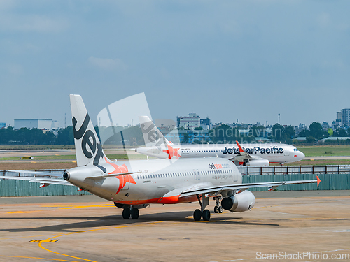 Image of Two Jetstar Airbus A320 in Ho Chi Minh City, Vietnam