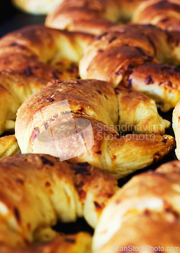 Image of Bakery, croissant and bread in a store with coffee shop food and product in a kitchen. Fresh, closeup and French pastry with patisserie and dessert in a cafe with flour and wheat for a snack