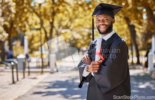 Image of Graduation portrait, diploma and man or student on university, education or college campus and scholarship success. African person or happy graduate arms crossed with certificate or award in park