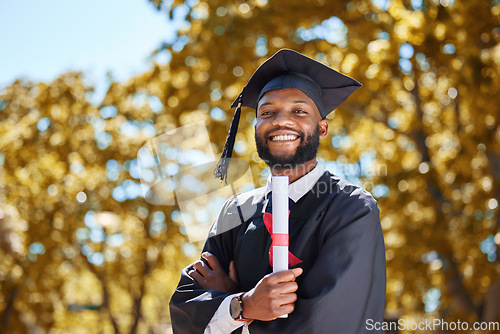 Image of Graduation cap, portrait and man or student on university, education or college campus and scholarship success. African person or happy graduate arms crossed with diploma or certificate award in park