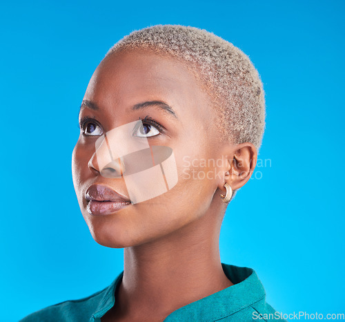Image of African woman, face and cosmetics for makeup, beauty and skincare for natural skin glow on studio blue background. Cosmetic, care and model thinking of idea for treatment, facial or decision