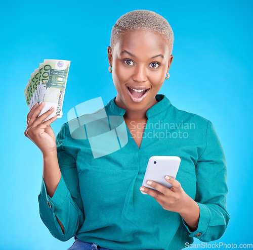 Image of Money, phone and woman in surprise portrait, finance winning and online savings or cash prize. Success, lottery and wow of african person mobile gambling, profit or cashback on studio blue background