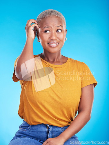 Image of Black woman, scratch head and confused in studio with thinking, mindset or ideas for decision by blue background. African girl, stress and finger on hair for fear, scared and brainstorming for choice