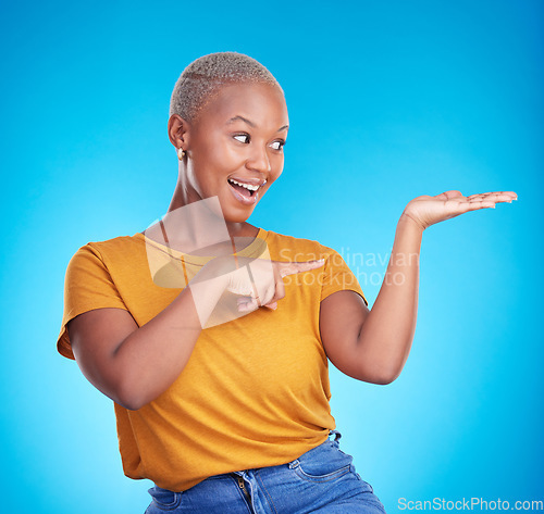 Image of Decision, choice and black woman showing, presentation and information against a blue studio background. Discount deal, female person and excited model with options, advertising and product placement