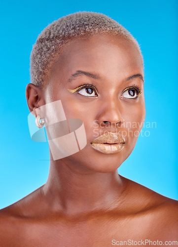 Image of African woman, face and creative makeup, beauty and cosmetics for skincare or natural skin glow on studio blue background. Cosmetic, care and model thinking of idea for facial, treatment or fashion