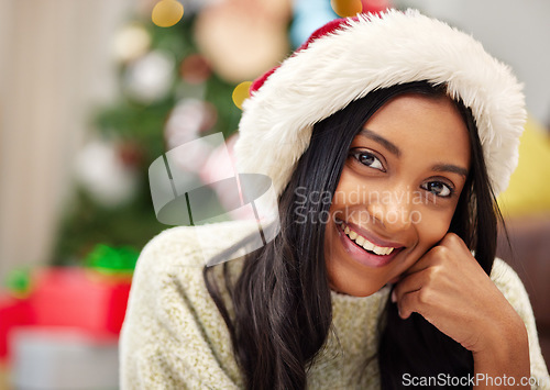 Image of Happy woman, face and portrait with Christmas hat for festive season, celebration or gift giving time at home. Female person with smile in relax for holiday, weekend or December party at the house