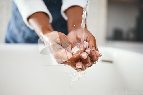 Image of Woman cleaning hands, water and hygiene in bathroom, safety from bacteria and germs, disinfection and skincare. Health, wellness and female person at home, sustainability and healthy with handwashing