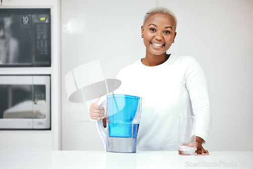 Image of Water, filter and pitcher for woman in kitchen to refresh with glass of liquid hydration. Portrait, happy black female person or jug of pure aqua beverage for drinking cold or clean nutrition at home