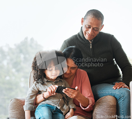 Image of Grandparents, happy family and relax child with phone for subscription movie, online games or home streaming app. Kid bond, smartphone and senior people watch social network, media or cartoon video