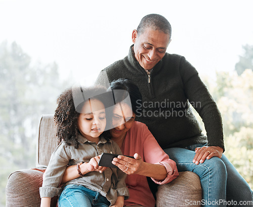 Image of Grandparents, happy family and relax kid with cellphone for subscription movie, online gaming or scroll on child app. Home bond, phone or elderly people babysit grandson, watch media or cartoon video