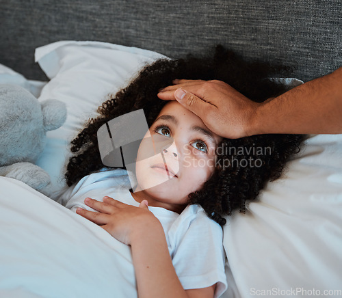 Image of Sick, fever and girl child in bed for rest to recover from flu, cold or allergies at her home. Illness, tired and hand of father checking the temperature of his daughter in her bedroom at their house