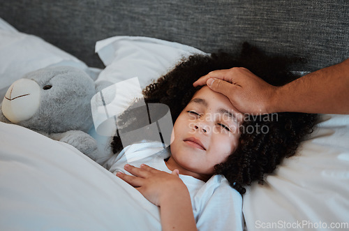 Image of Sick, fever and kid sleeping in bed for rest to recover from flu, cold or allergies at her home. Illness, tired and hand of father checking temperature of his daughter in her bedroom at their house.