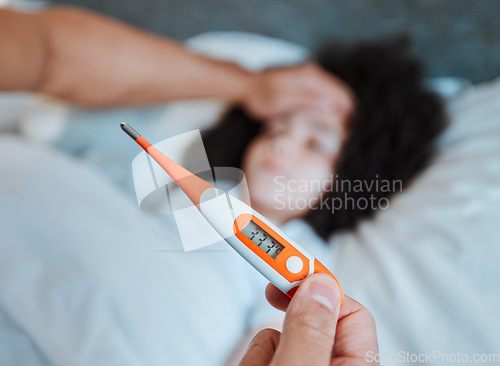 Image of Thermometer, temperature and parent with a sick child, fever and health check in a home bedroom. Medical, care and hand of a man with a tool for covid results, virus and a cold of a girl in a bed