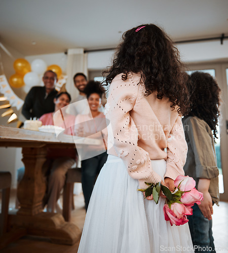 Image of Hiding flowers, surprise and family at a birthday celebration with children with a gift together. Love, mothers day or kids giving a floral present at a home party for parents or grandparents