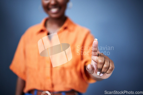 Image of Finger, interface and a black woman user in studio on a blue background for internet browsing or access to information. Future, hand and app with biometrics of a female person showing her fingerprint