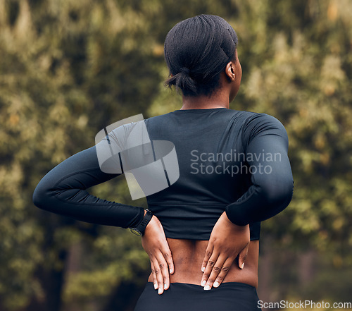 Image of Back pain, fitness and sports woman outdoor for scoliosis, health risk and tired from running in park. Female athlete, runner and exercise injury of muscle, joint problem and first aid for hurt spine