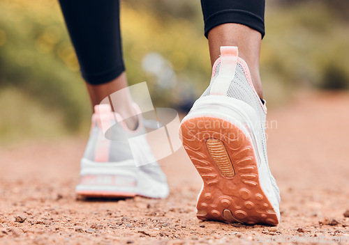 Image of Shoes, fitness and person walking or hiking for outdoor exercise, workout or training as health and wellness. Sneakers, closeup and feet of active sports athlete or runner running a marathon