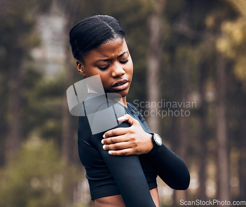 Image of Shoulder, pain and sports woman outdoor for health risk, bruise and hands on wound in park. Fitness, black female athlete and arm injury of muscle, joint problem and first aid for exercise accident