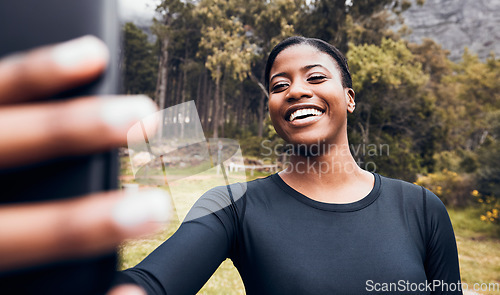Image of Fitness, black woman taking a selfie and in forest for social media motivation. Workout sportswear or training, exercise or health wellness and African female athlete happy in woods for running