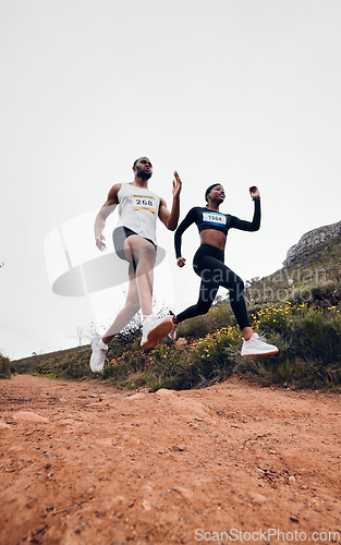Image of Running, jump and couple in mountain with fitness workout and training on a race and marathon. Runner, young people and road on a exercise challenge outdoor with sport cardio performance in nature