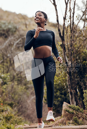 Image of Nature, fitness running and woman for body training and cardio wellness, outdoor challenge or happy hiking. Sports runner, athlete or african person for health workout and marathon exercise in forest