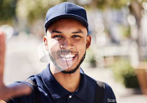 Image of Delivery, selfie and portrait of a man in the city while doing courier work with transport. Happy, smile and headshot of a male ecommerce worker taking a picture while dropping a package in town.