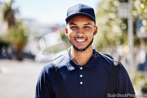 Image of Happy, delivery and portrait of a man in the city for courier work and ecommerce job. Smile, retail and a headshot of a male service worker in the shipment industry and in town while working