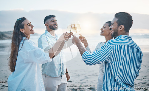 Image of Friends, smile and toast with champagne on beach, having fun and bonding at sunset. Ocean, group and people cheers with wine glass, alcohol and drink for celebration on holiday, summer party and sea.