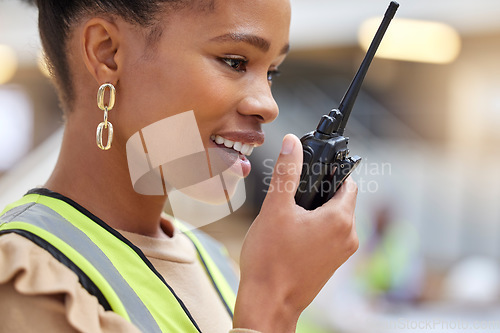 Image of Walkie talkie, black woman and engineer planning, communication and construction. African architect, radio and happy contractor with industrial project, building maintenance and logistics discussion.