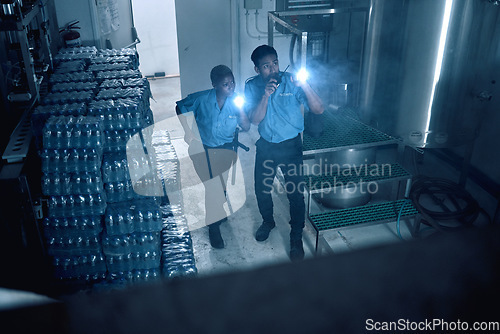 Image of Security, emergency and team of police investigate a crime in a store at night or in the evening for protection. Teamwork, job and professional safety employees search a room for criminal danger