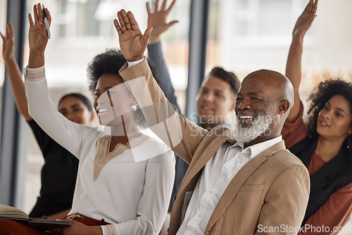 Image of Happy business people, workshop or hands up for participation in seminar for learning skills in office. Vote, men or women in audience together for group mentorship, training or coaching in workplace