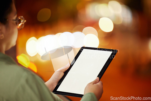 Image of Woman, hands and tablet with mockup at night in city for communication, networking or browsing outdoors. Hand of female person or freelancer working late with technology display in an urban town