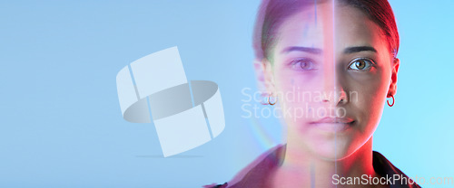 Image of Face overlay, futuristic and woman on studio blue background for cyberpunk, digital world and biometric. Facial identity, neon lights and young gen z person in portrait for future technology banner