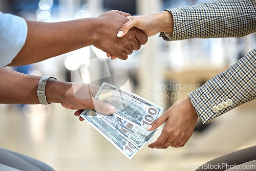 Image of Handshake, money and bribe for office crime, dirty deal and secret partnership for trading in financial industry. Business people, cash and payment for fraud, illegal negotiation and corruption