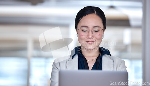 Image of Business, asian woman and laptop in office for online planning, typing email and internet search. Happy young female employee working on computer, reading website report and information on connection