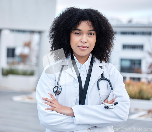 Image of Portrait, woman and doctor with arms crossed, healthcare and success with career, outdoor and life insurance. Face, female person and medical professional with wellness, motivation and proud expert