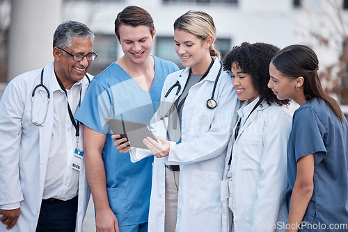 Image of Tablet, doctors and nurses in healthcare, hospital and outdoor for clinic management, research and teamwork. Group, telehealth and medical staff, mentor or people on digital technology for video call