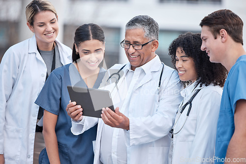 Image of Tablet, doctors and healthcare people at hospital outdoor with clinic management, research and online teamwork. Group, telehealth and medical staff, nurses and mentor with digital technology training