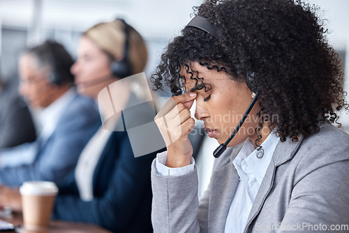 Image of Headache, tired or woman in call center with burnout, head pain or overworked in crm communication. Migraine, office or stressed telemarketing sales agent frustrated with anxiety, fatigue or problem