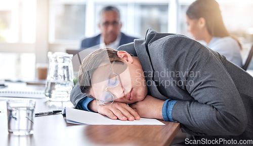 Image of Sleeping, tired and business man in meeting for overworked, exhausted and stress. Mental health, fatigue and burnout with male employee in office for insomnia, conference and time management