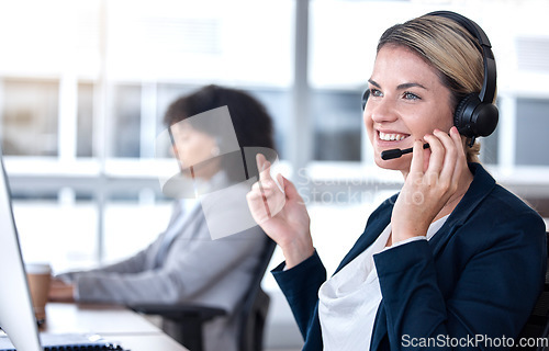 Image of Call center, talking and happy woman in office for communication, support and contact us for customer service. Smile, telemarketing and sales agent, consultant or employee listening to conversation.