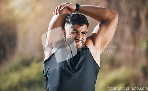 Image of Fitness, stretching and man outdoor for training, running or workout on blurred background. Arm, stretch and Indian guy runner with body warm up in nature before exercise, run or cardio sport routine