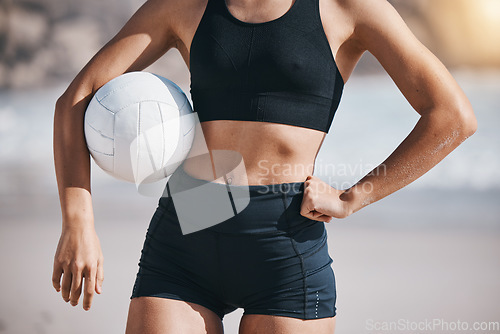 Image of Woman, volleyball and sports body on beach for workout exercise or training by the ocean coast. Active female person with ball in fitness for volley practice by sea or healthy wellness in nature