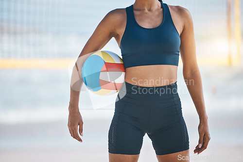 Image of Woman, beach and volleyball for fitness, sports or workout in exercise or training by the ocean coast. Body of active female person with ball for volley practice by sea or healthy wellness in nature