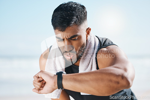 Image of Man, fitness and checking watch for performance on break after workout, running or training in nature. Fit, active or sporty male person looking at wristwatch for monitoring body exercise in outdoors