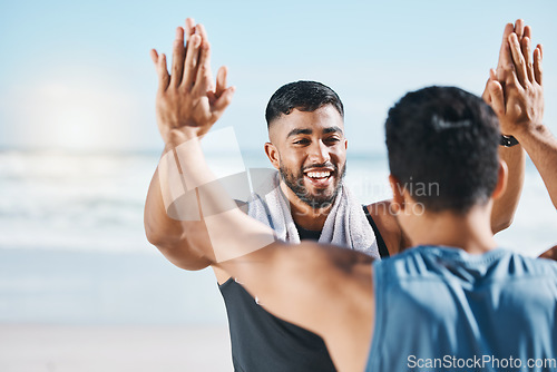 Image of High five, training success and people at beach celebration, winning and workout goals or teamwork. Fitness, exercise and sports men, personal trainer or athlete friends, hands together and support